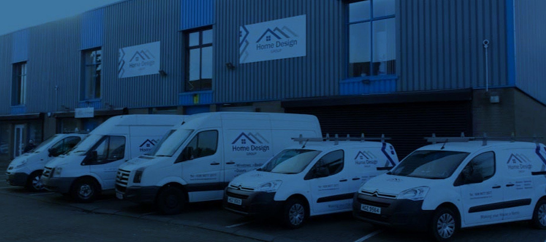 The Home Design Group van fleet outside the Belfast premises