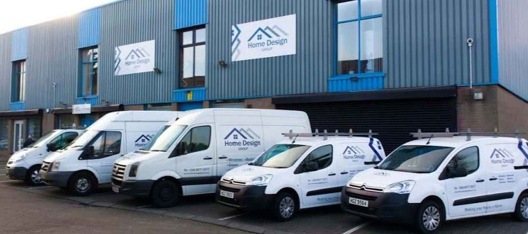 The Home Design Group van fleet outside the Belfast premises