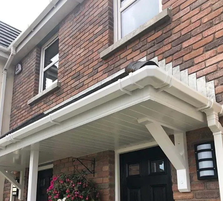 Cream uPVC soffit board under a front door canopy